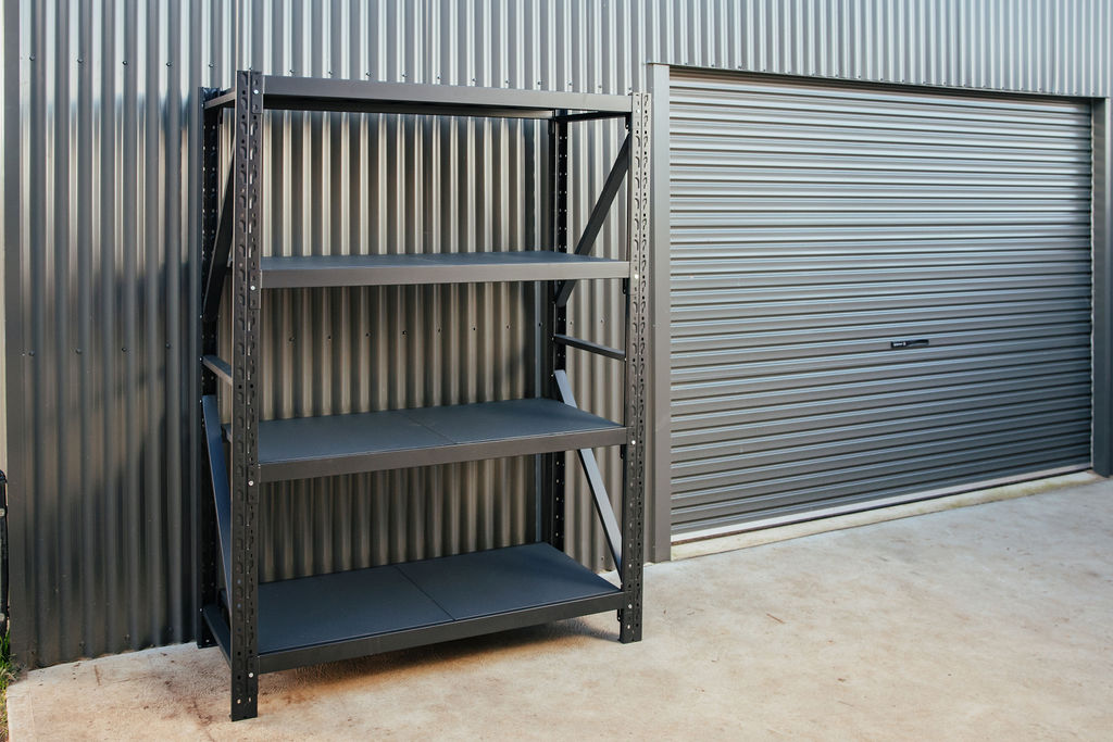 Shelves from shelving and storage ne outside, agains the garage